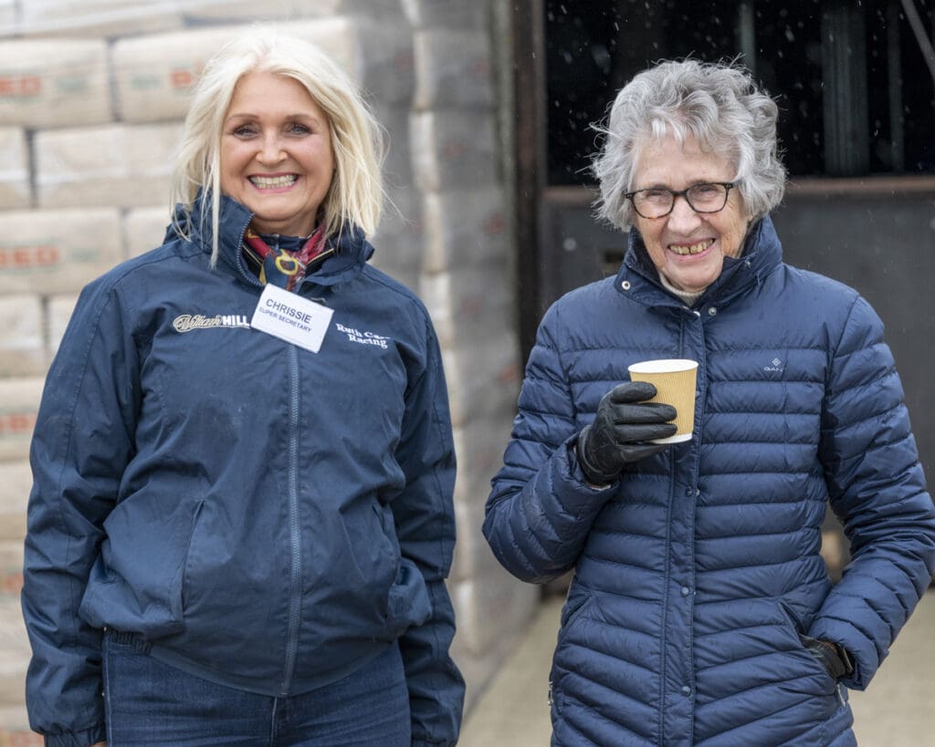Chrissie and Grandma shelter from the rain