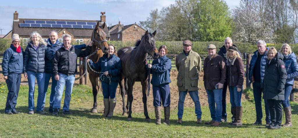 Invincible Crown and Invitorio pose with members