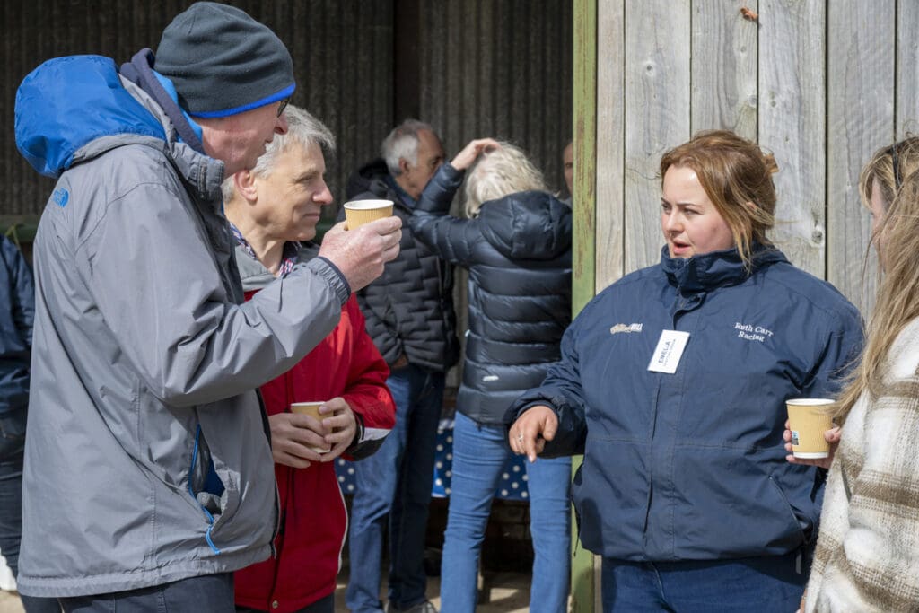 Emelia chats to the guests over coffees